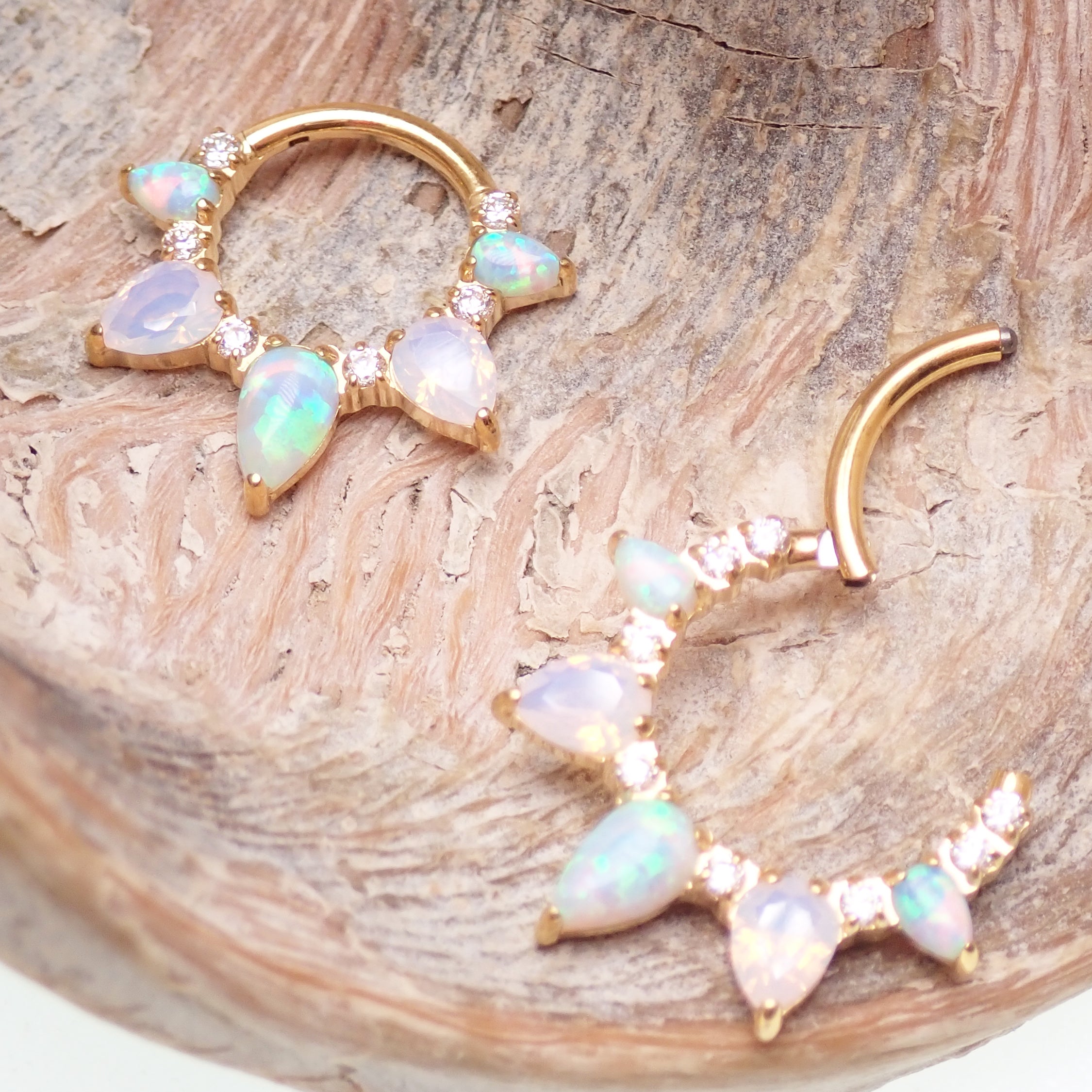 Arctic Glow opal and opalite CZ PVD gold titanium clicker piercing for body jewelry, showcasing a sleek, modern design.