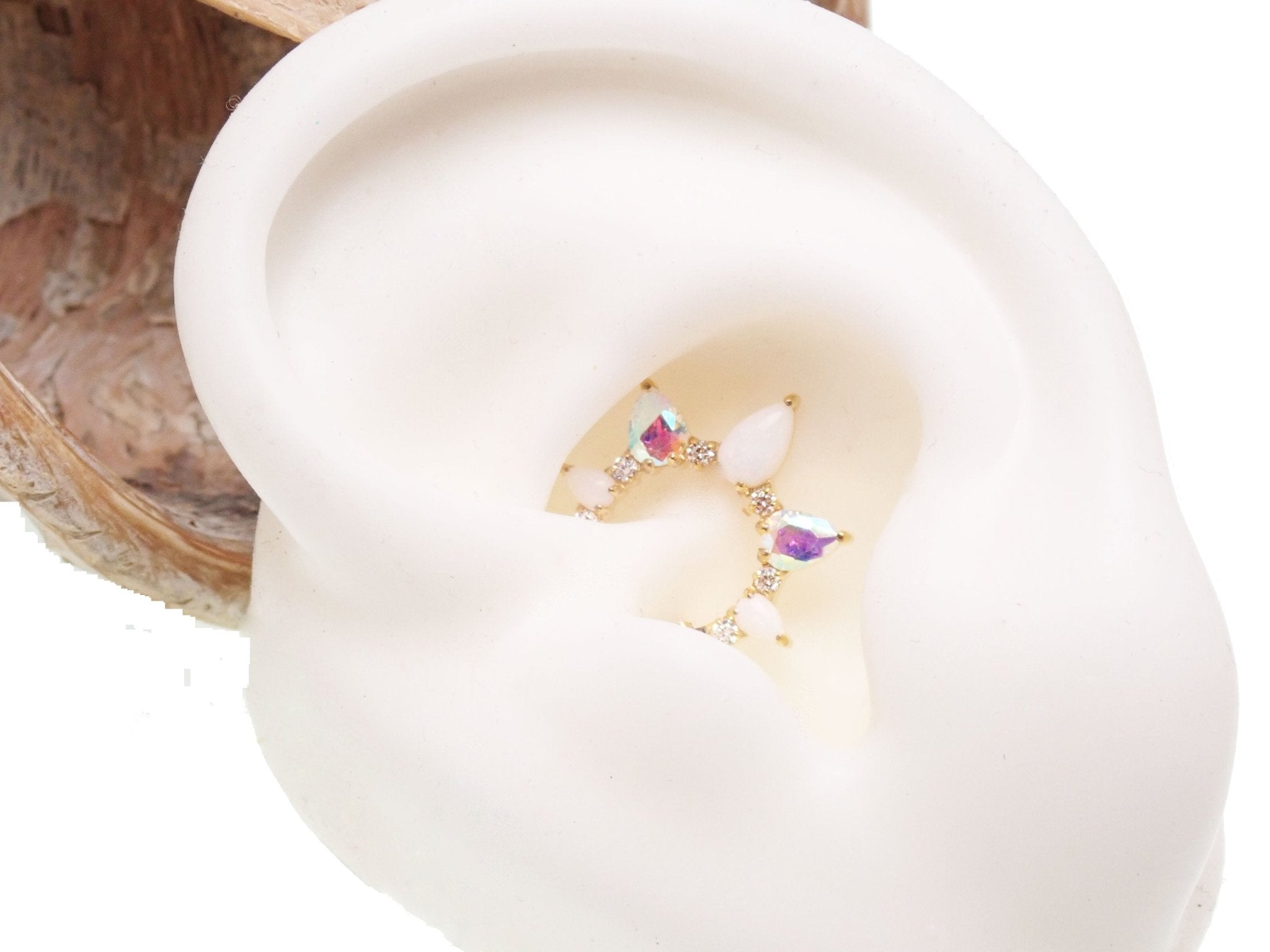 White opal PVD gold implant titanium clicker piercing, 16g body jewelry with 8mm opal and gold finish.