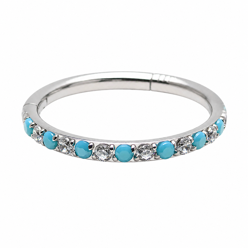 Side-facing turquoise and CZ alternating clicker body jewelry in 18g with a sleek silver finish, designed for piercings.