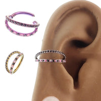 Pink and black conch-shaped titanium clicker body jewelry with double layer 16g split opal and cubic zirconia accents.