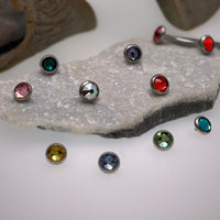 CZ Titanium Tops Body Jewelry by Body Clickers, 16g body jewelry with citrine-colored CZ accents and titanium posts.