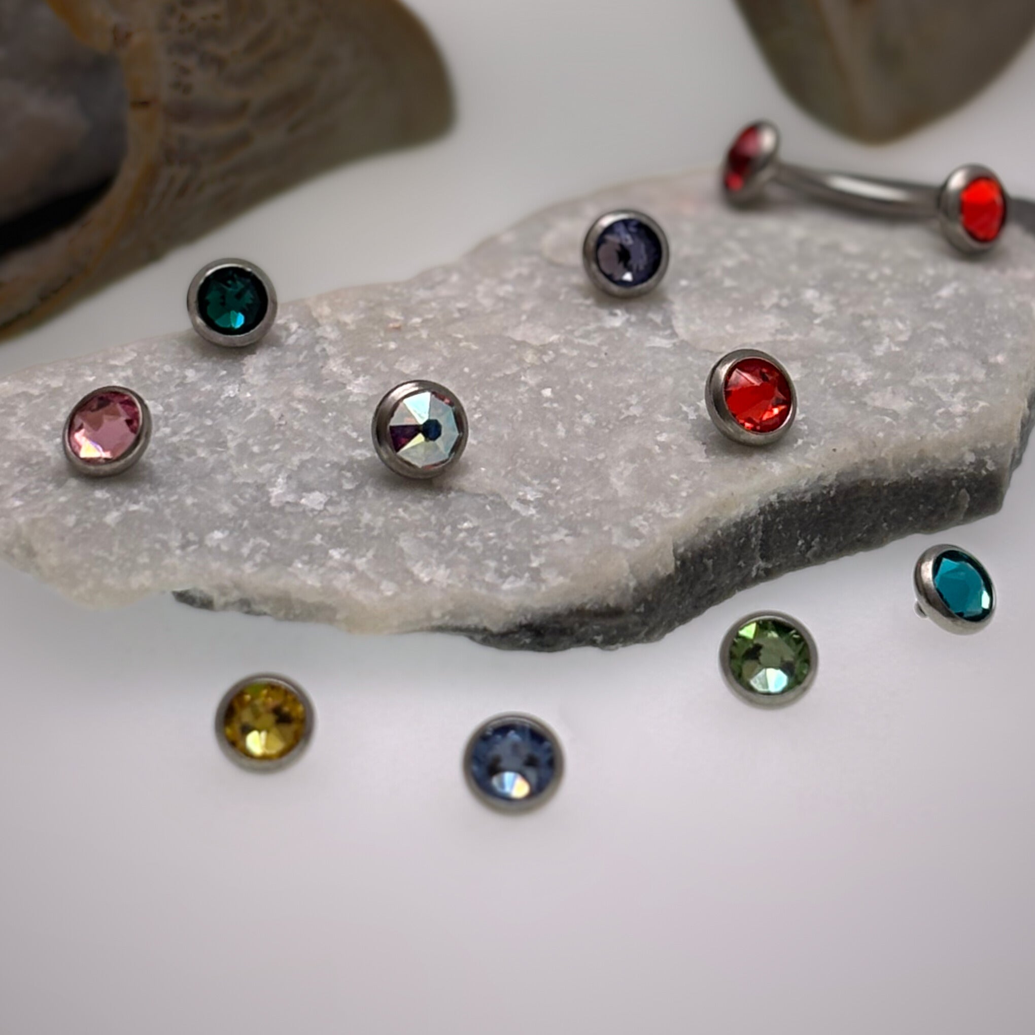 CZ Titanium Tops Body Jewelry by Body Clickers, 16g body jewelry with citrine-colored CZ accents and titanium posts.