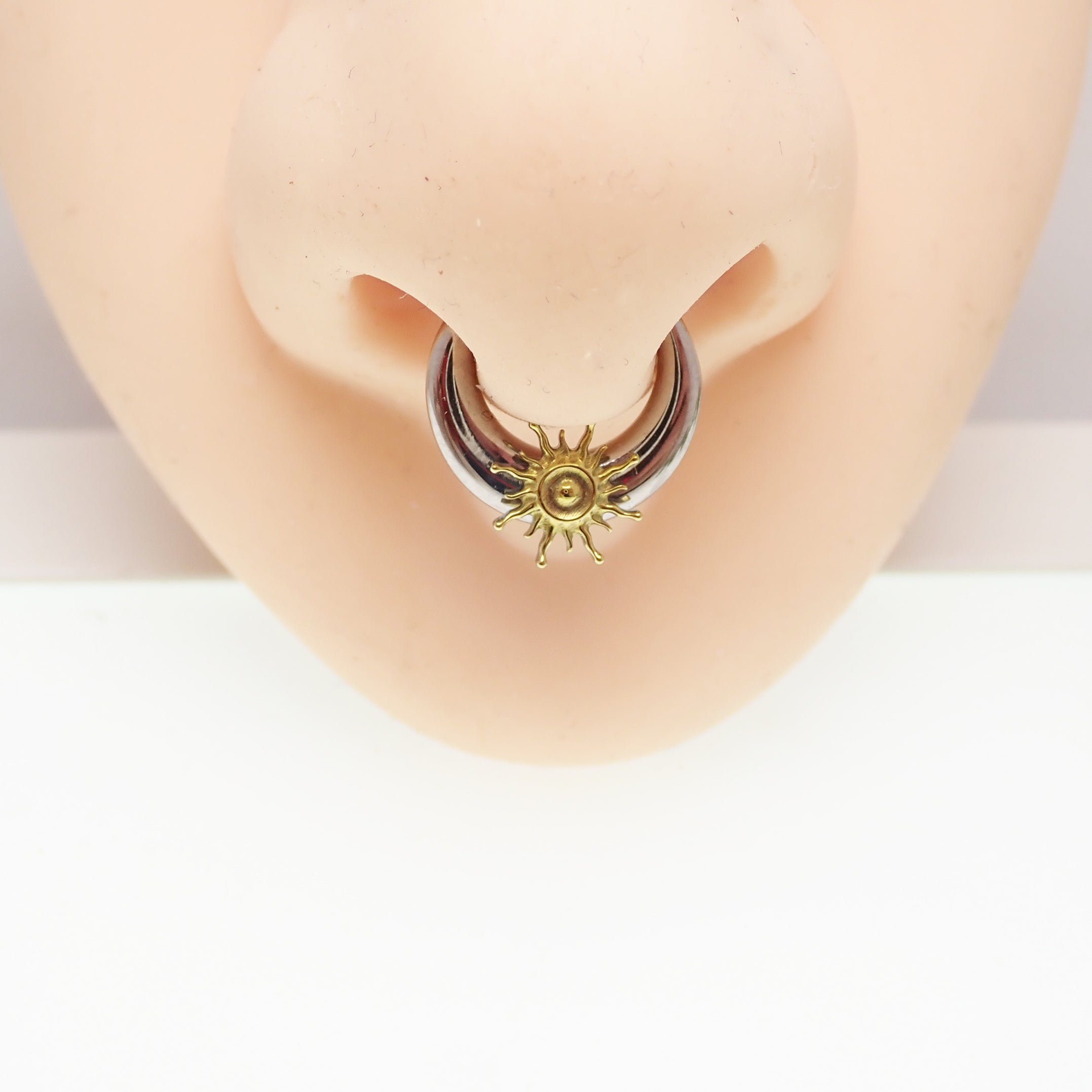 Titanium Sunburst Implant Clicker in 16G/14G with 8mm diameter, body jewelry featuring a sunburst design and clicker clasp.