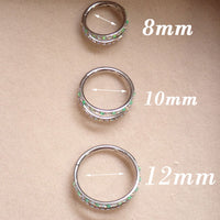 16g titanium implant clicker with kiwi green opal and AB CZ double row design for body jewelry piercing.