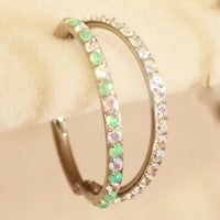 16g titanium implant clicker with kiwi green opal and AB CZ double row design for body jewelry piercing.