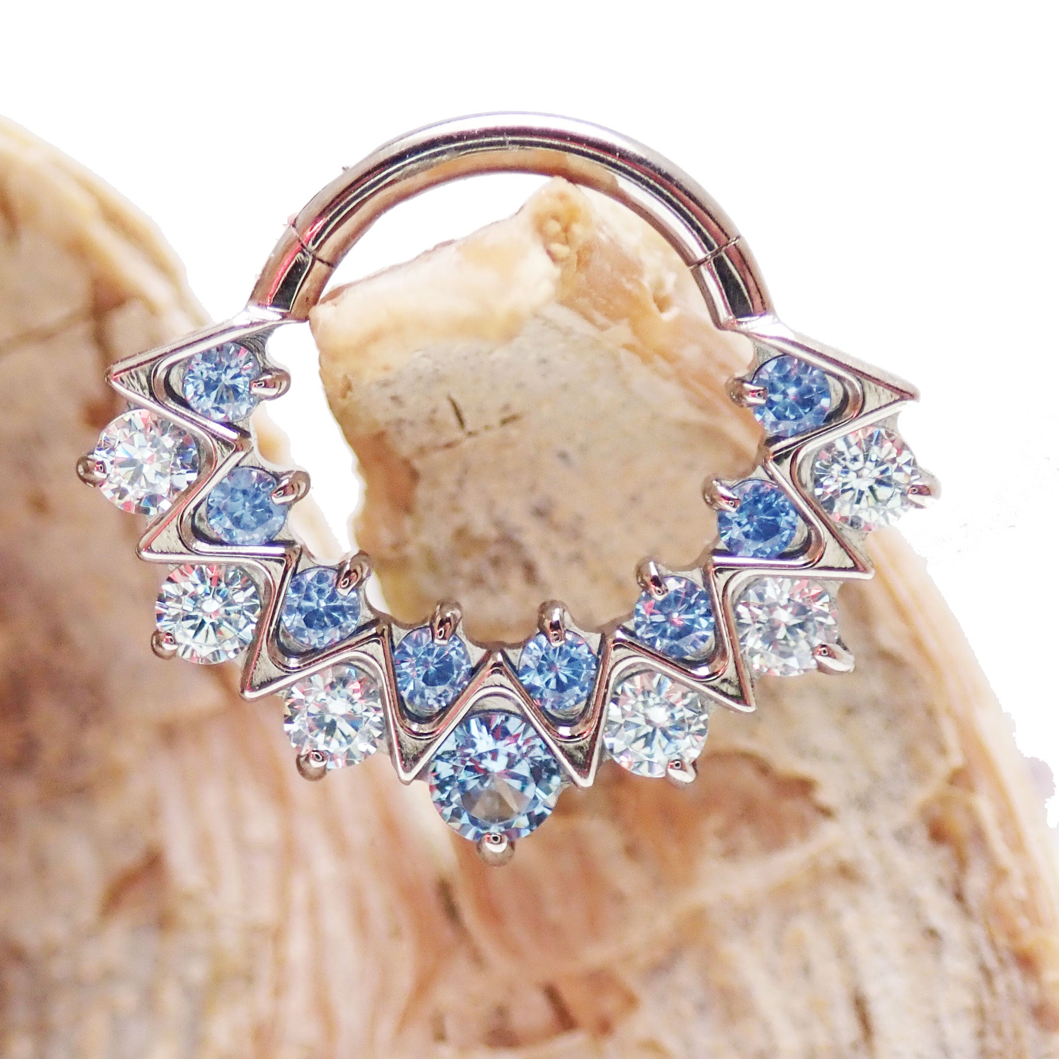 Blue CZ 16G titanium clicker jewelry for daith or septum piercings, from Body Clickers Body Jewelry, with a sleek and secure design.