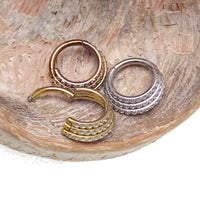 Titanium stacked clicker body jewelry with CZ stones, 16g gauge, 8mm size, featuring a stylish and secure design for piercings.