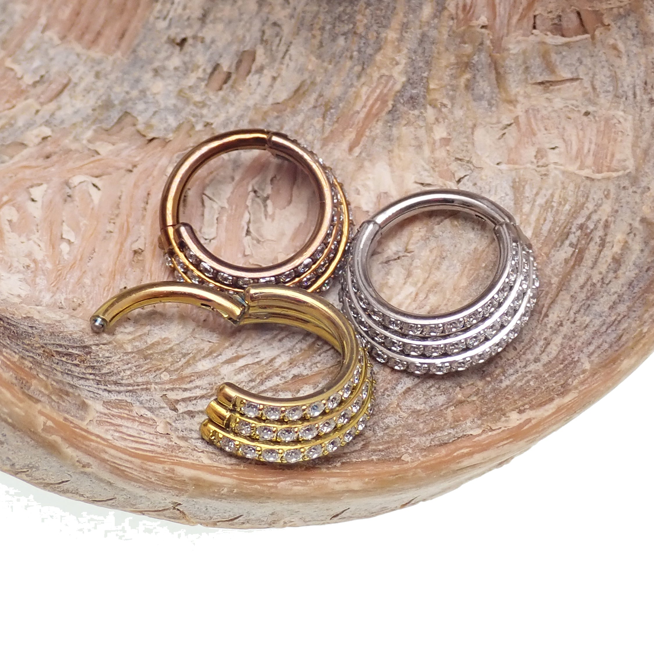 Titanium stacked clicker body jewelry with CZ stones, 16g gauge, 8mm size, featuring a stylish and secure design for piercings.