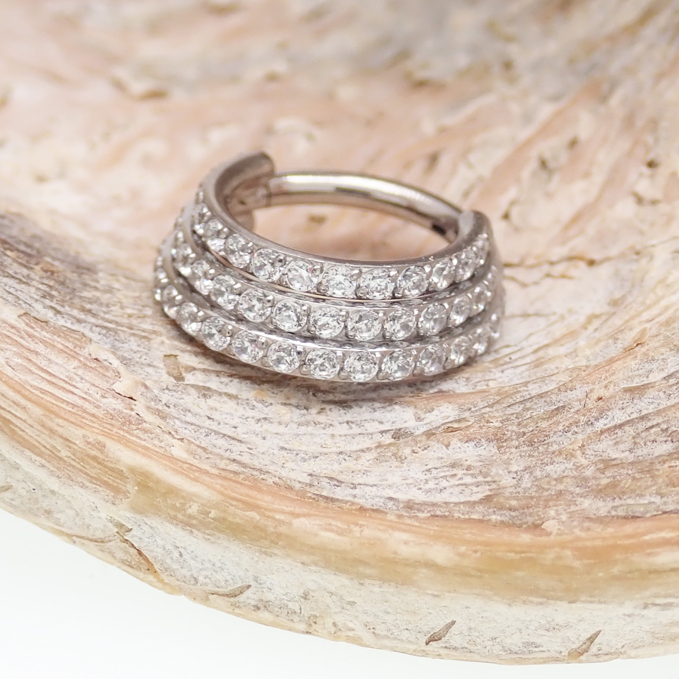 Titanium stacked clicker body jewelry with CZ stones, 16g gauge and 8mm diameter, from Body Clickers Body Jewelry.