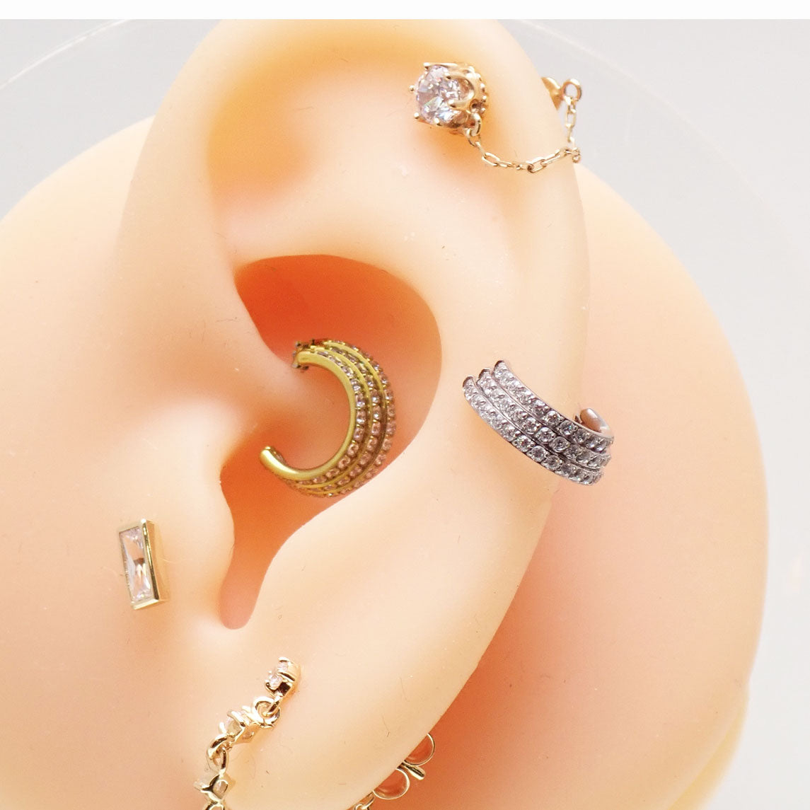 Titanium stacked clicker body jewelry with CZ stones, 16g gauge and 8mm diameter, from Body Clickers.