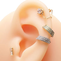 Titanium stacked clicker with CZ stones, 16g 8mm body jewelry, featuring sparkling cubic zirconia accents on a sleek clicker design.