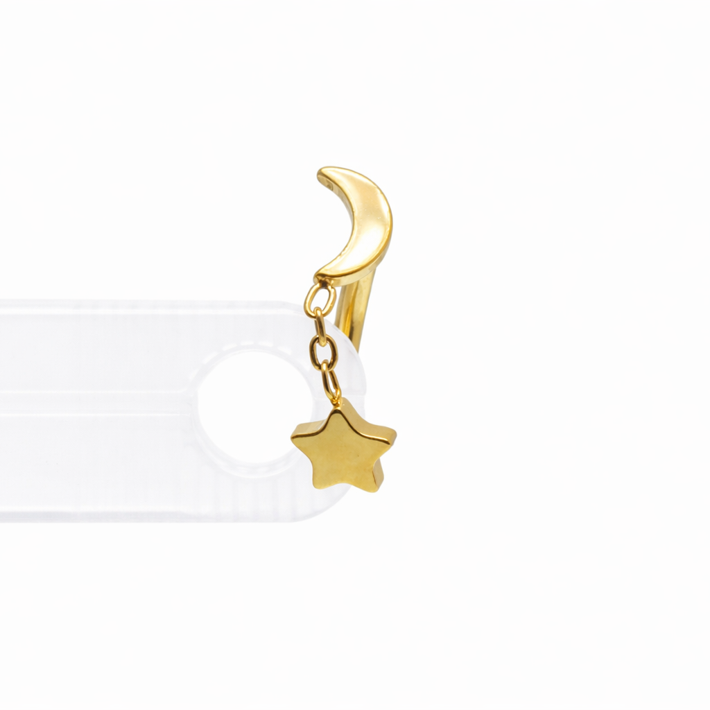 Gold 16g titanium internally threaded curve barbell with moon and star chain, eyebrow and rook jewelry from Body Clickers Body Jewelry.