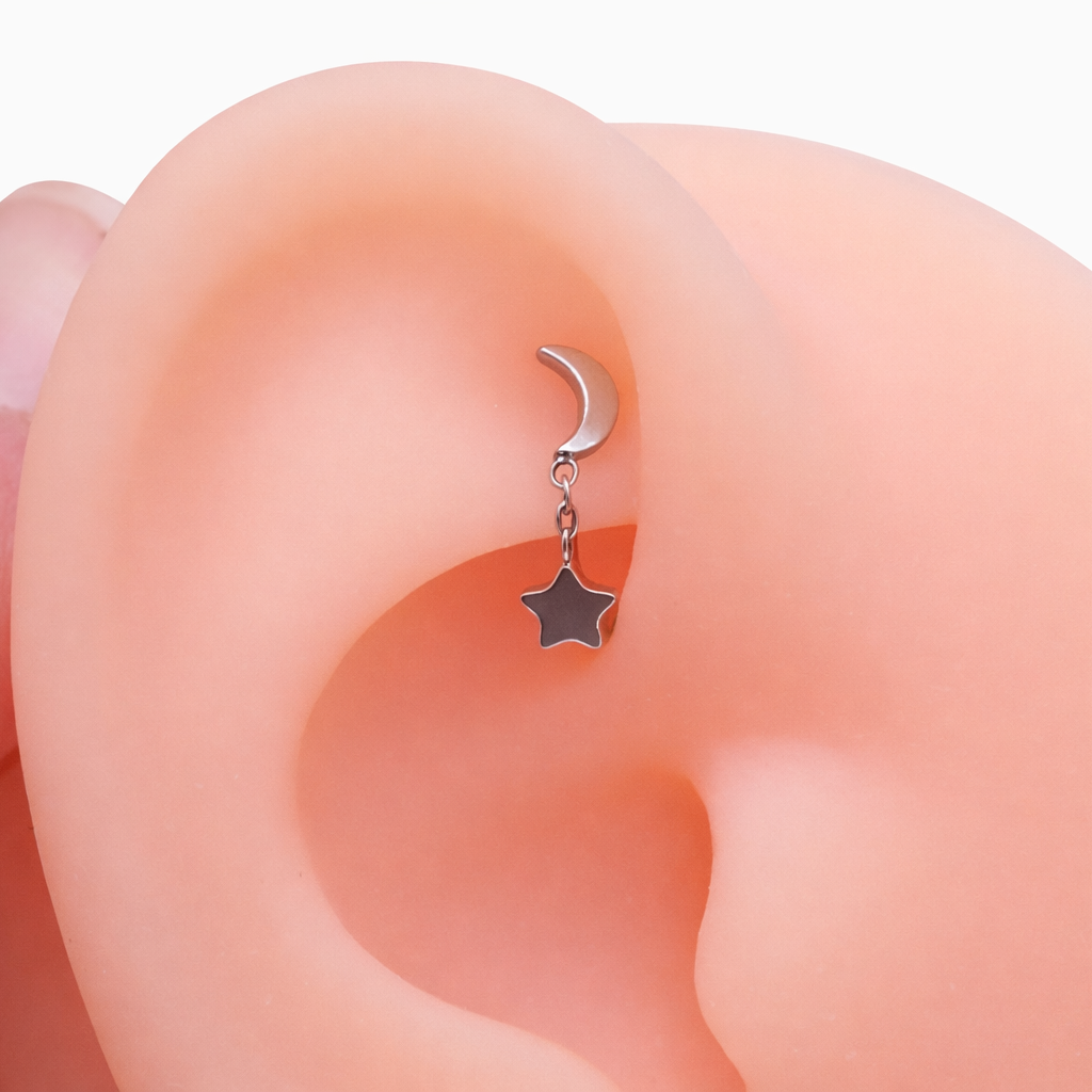 Titanium 16g internally threaded curve barbell with moon and star chain for eyebrow and rook piercings by Body Clickers Body Jewelry