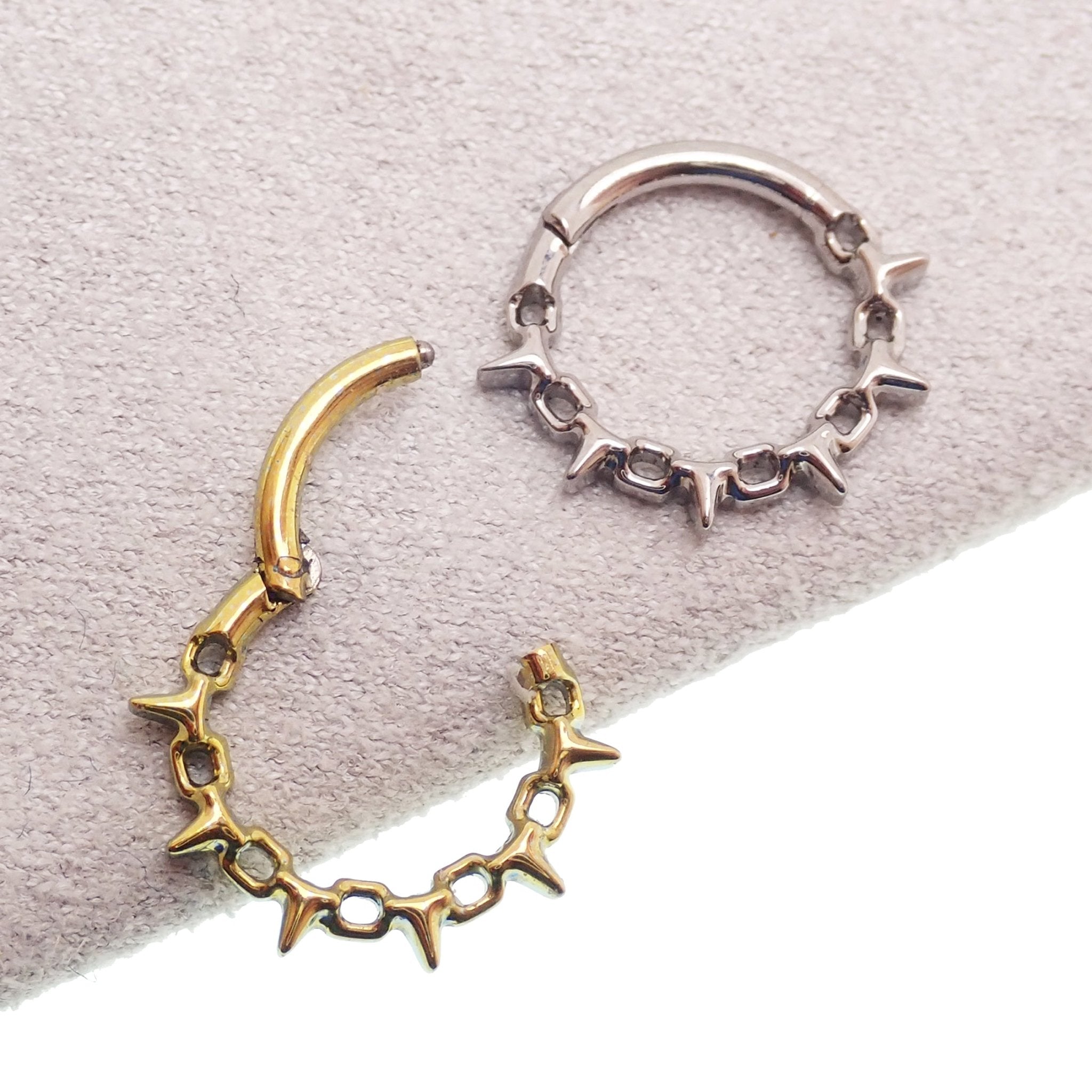 16G chain spike hinged clicker body jewelry with 8mm width, featuring a sleek design and spiked accents for pierced ears or cartilage