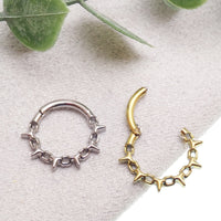 16G chain spike hinged clicker body jewelry with 8mm design, featuring a stylish spike and chain detail in a sleek piercing ring.