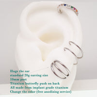Triple hoop stud earrings made of implant titanium, hypoallergenic body jewelry with a sleek, minimalist design.