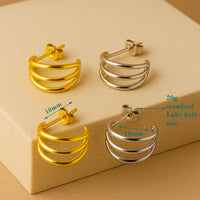 Triple hoop stud earrings made of implant titanium, hypoallergenic body jewelry with a sleek, minimalist design.