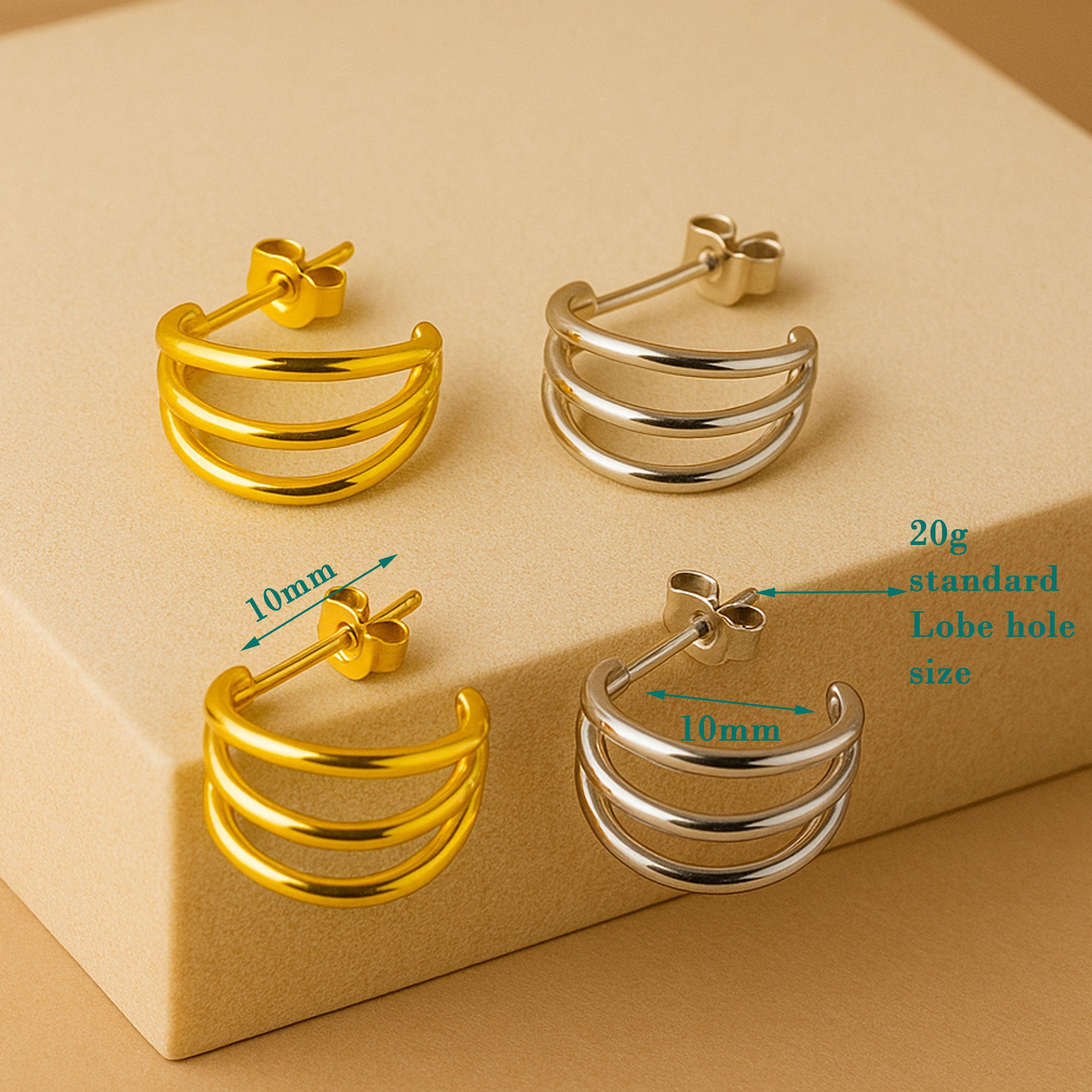 Triple hoop stud earrings made of implant titanium, hypoallergenic body jewelry with a sleek, minimalist design.