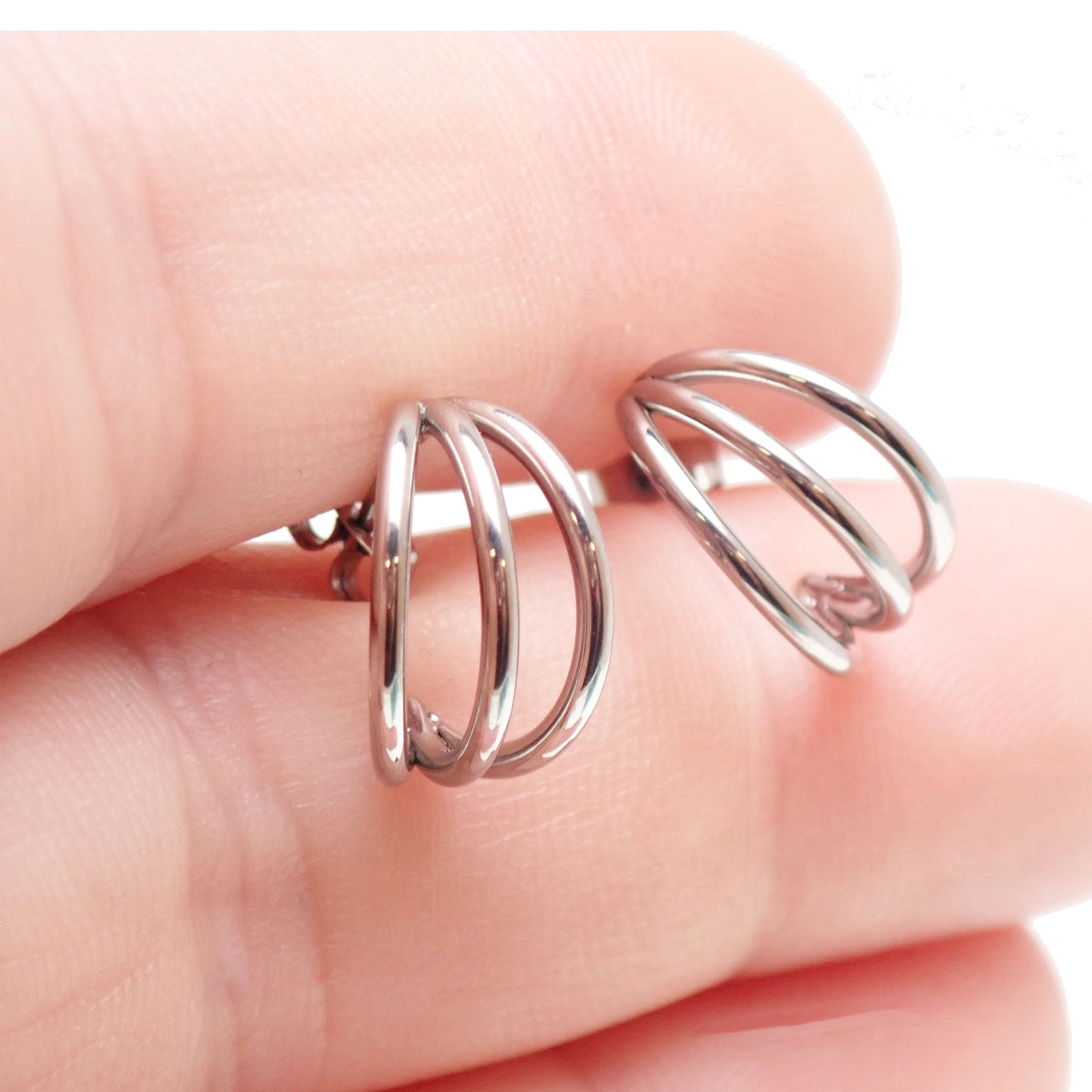 Triple hoop stud earrings from Body Clickers with hypoallergenic titanium implants, featuring sleek, minimalist jewelry design.
