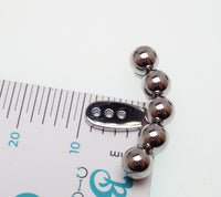 Pair of Body Clickers titanium implant earrings with jacket hangers, featuring smooth ball designs for body jewelry piercing.