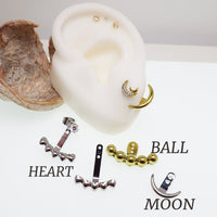 Pair of Body Clickers titanium implant earrings with jacket hangers, designed for advanced body jewelry piercing.