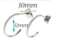 Pair of Body Clickers titanium hoop earrings with simple clear CZ stones, designed for body jewelry and implant piercing.