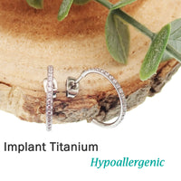 Pair of Body Clickers titanium hoop earrings with simple CZ stones, suitable for implant jewelry, shown in a close-up image.