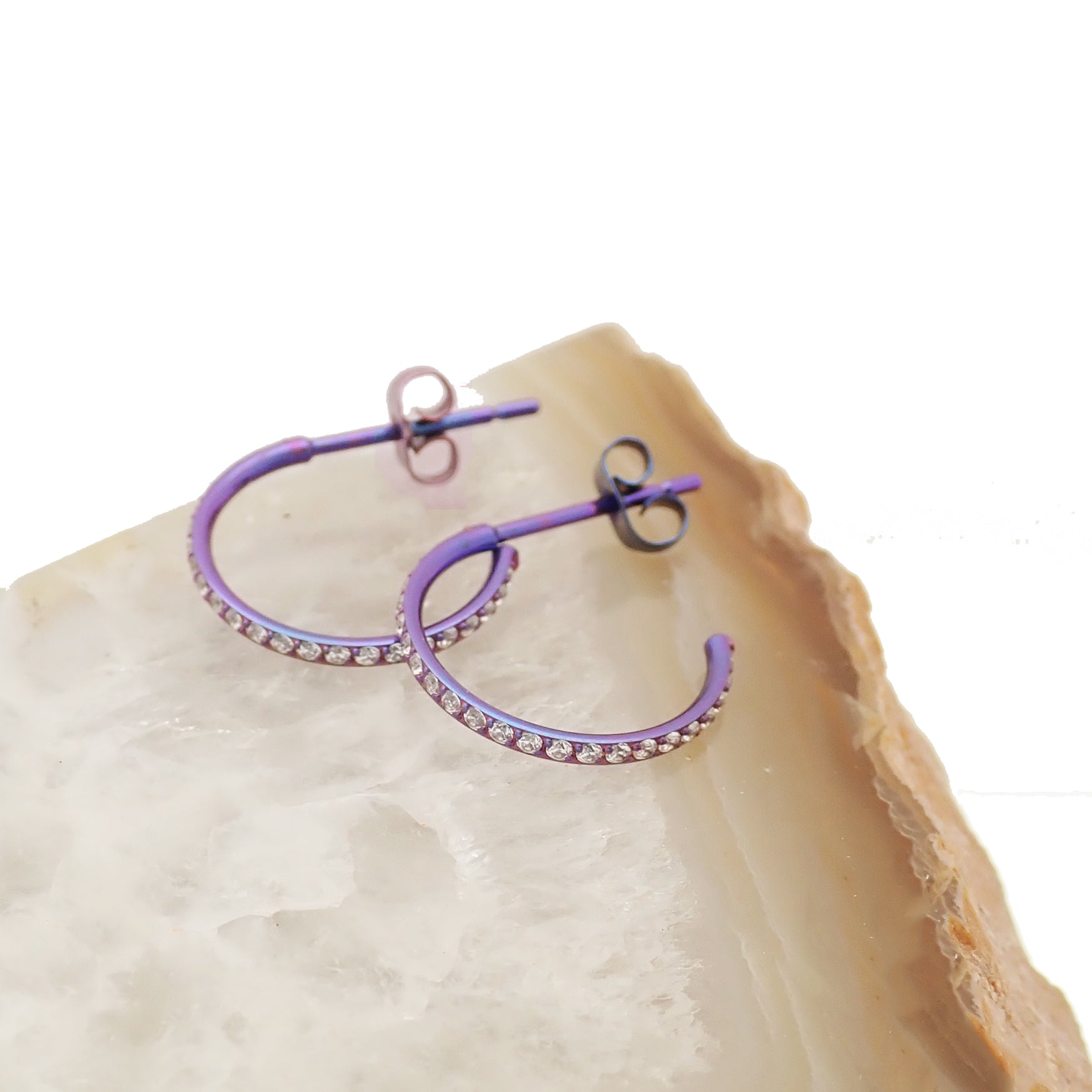 Pair of Body Clickers titanium hoop earrings with simple clear cubic zirconia accents, ideal for body jewelry and piercing accessories.