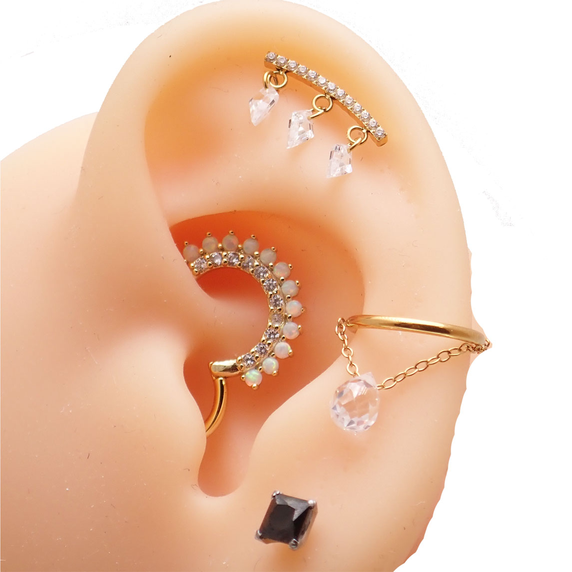 Titanium push fit threadless flat back helix piercing with gold and black CZ stones by Body Clickers Body Jewelry