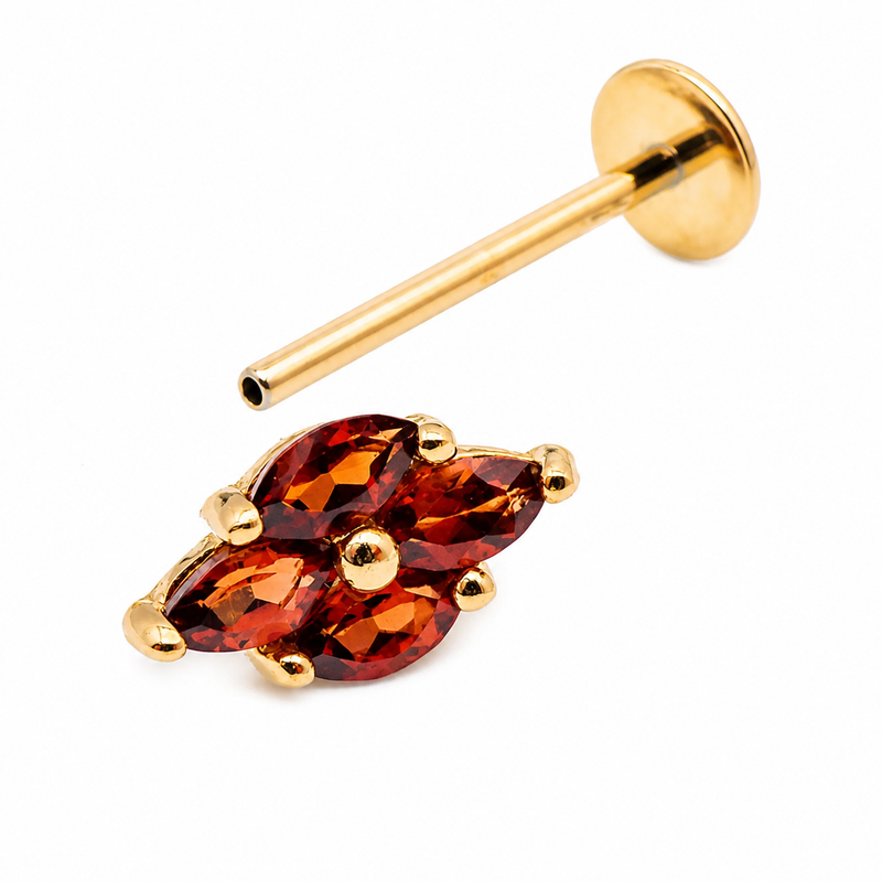 14K gold natural garnet threadless labret piercing with flat back design, showcasing a vibrant red gemstone for body jewelry.