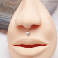 Large CZ teardrop flat back body jewelry by Body Clickers in 14g, 16g, 18g with garnet-colored cubic zirconia.
