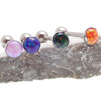 14g titanium tongue or cheek barbell piercing with orange gemstone accents from Body Clickers Body Jewelry.