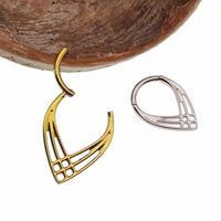 Elvish Celtic hinged titanium clicker body jewelry in 16g with intricate Celtic design on a clear background.