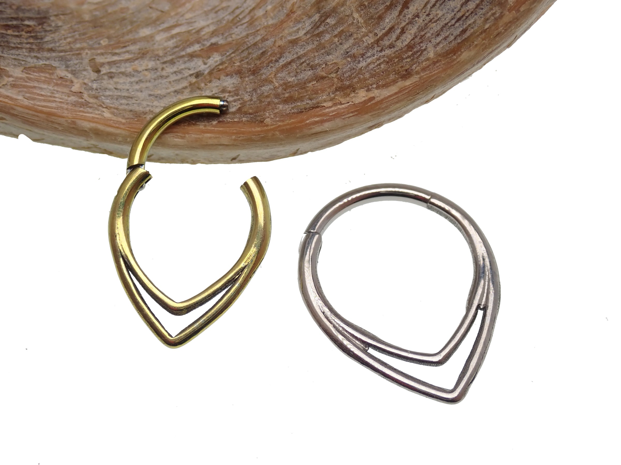 V-shaped hinged clicker body jewelry in 16g with 8mm size from Body Clickers, featuring a sleek V design and hinged closure.