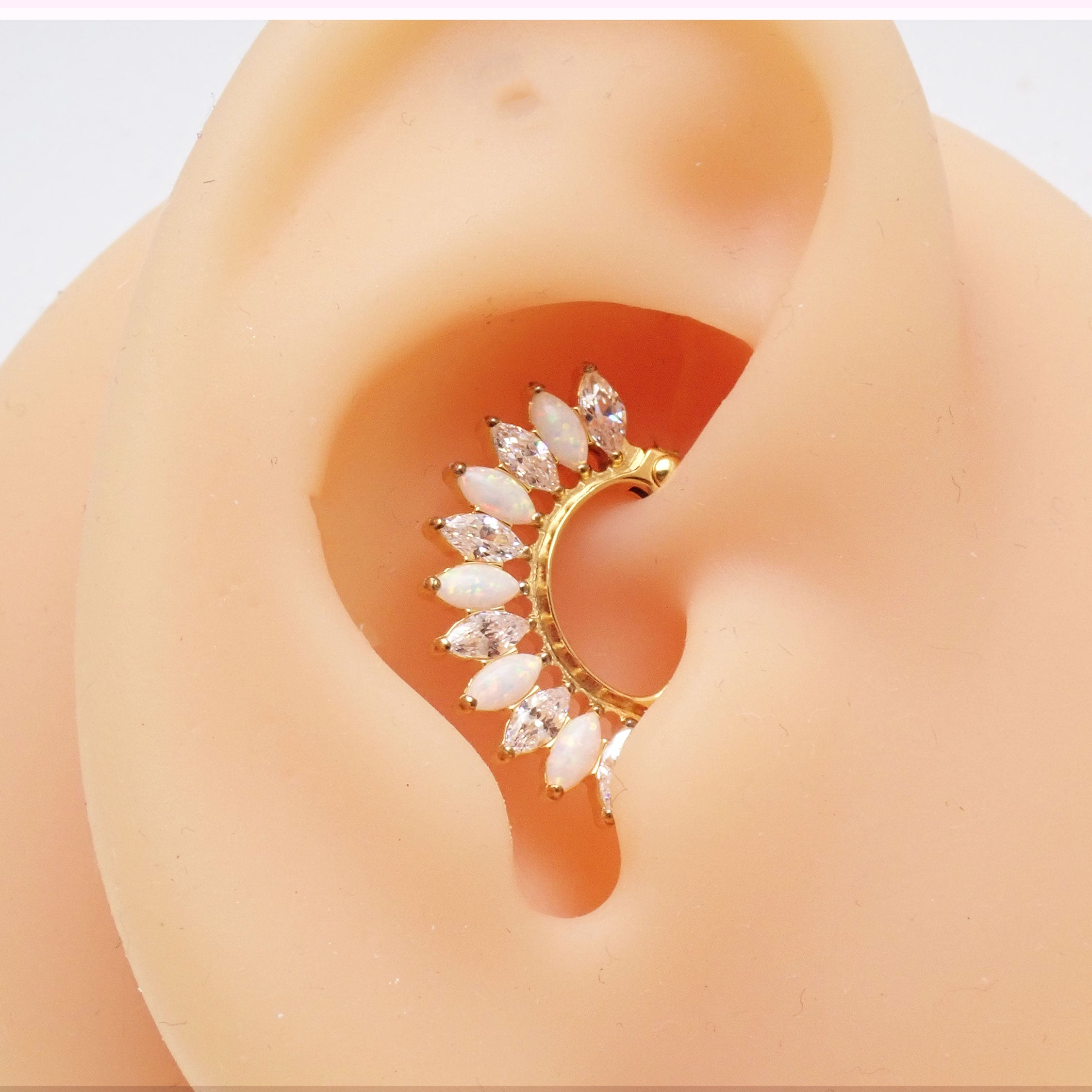 Hinged gold clicker earring in 16g implant grade titanium, small 7mm size, designed for body jewelry piercings