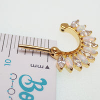 Implant grade titanium small gold 16g hinged clicker with 7mm diameter body jewelry for piercings.