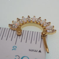 Implant grade titanium gold 16g small hinged clicker body jewelry with 7mm diameter, designed for body piercing.