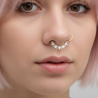 Implant grade titanium small gold 16g hinged clicker body jewelry with 7mm diameter, suitable for body piercing.