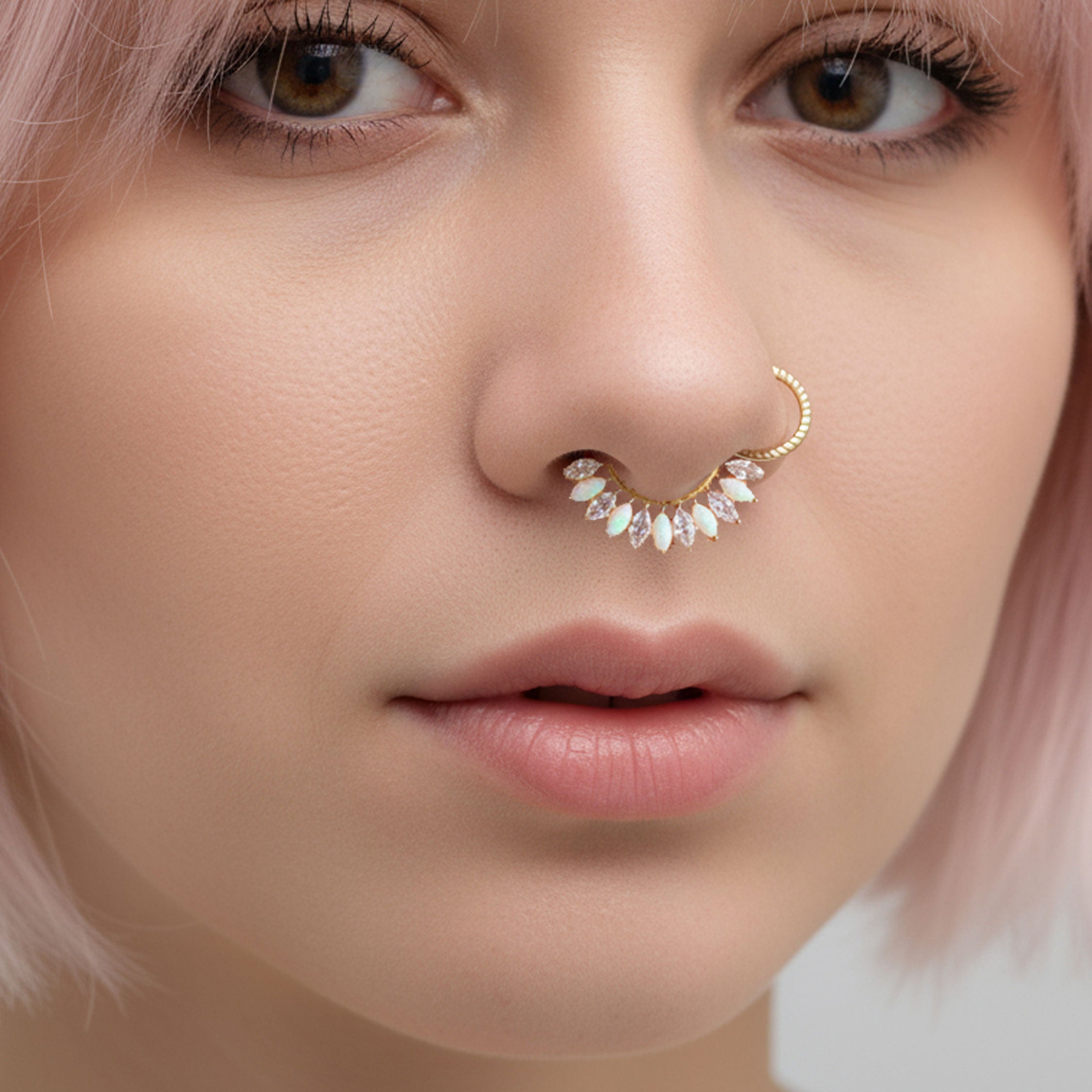 Implant grade titanium small gold 16g hinged clicker body jewelry with 7mm diameter, suitable for body piercing.