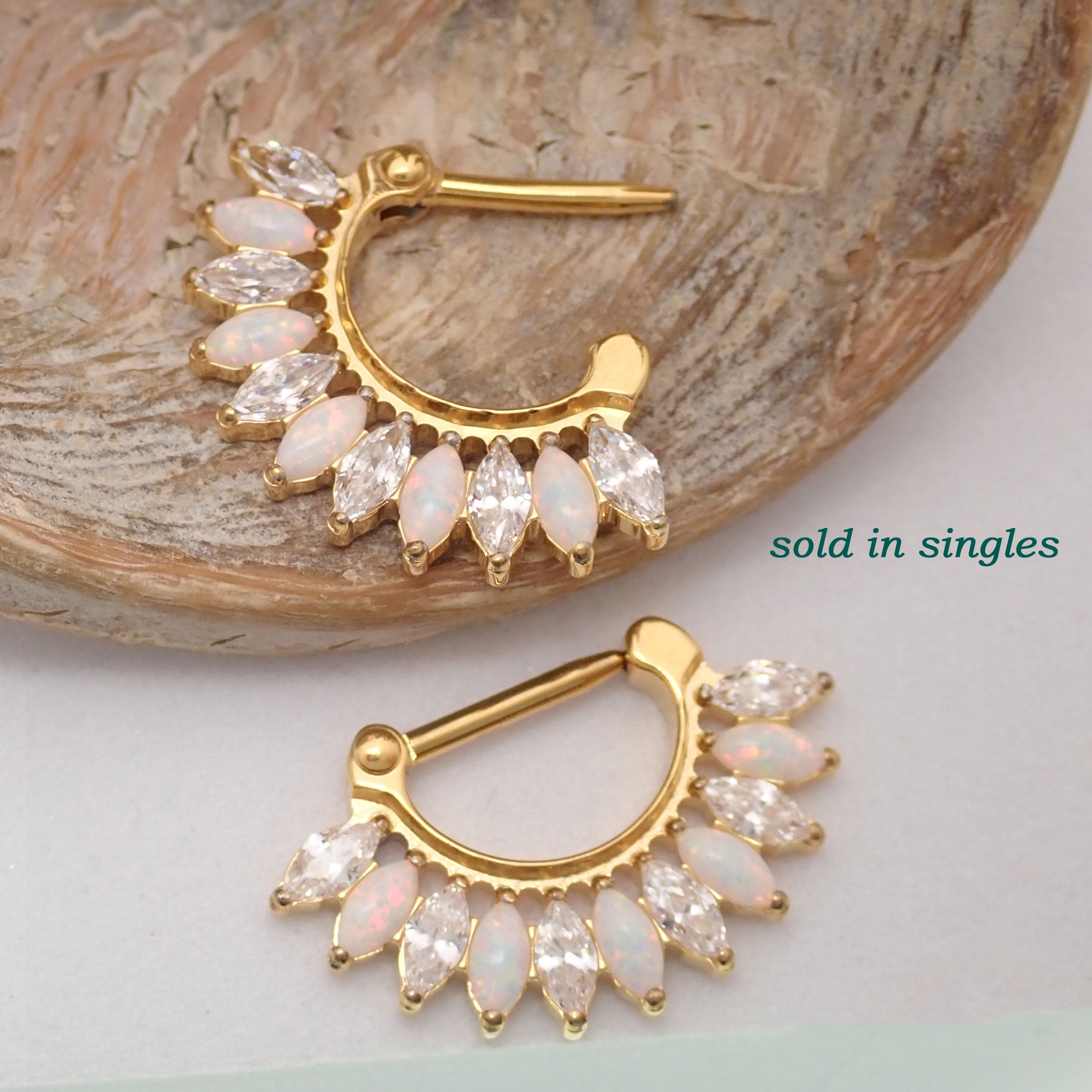 Hinged implant-grade titanium gold clicker jewelry, 16g small size with 7mm diameter for body piercing.