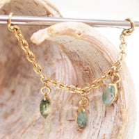 Implant titanium body jewelry with moss agate and moonstone charms, featuring a natural stone piercing chain design.