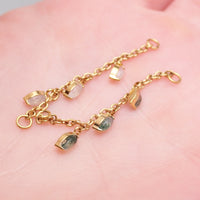 Body Clickers implant titanium body jewelry with moss agate and moonstone charms, featuring a natural stone piercing chain.