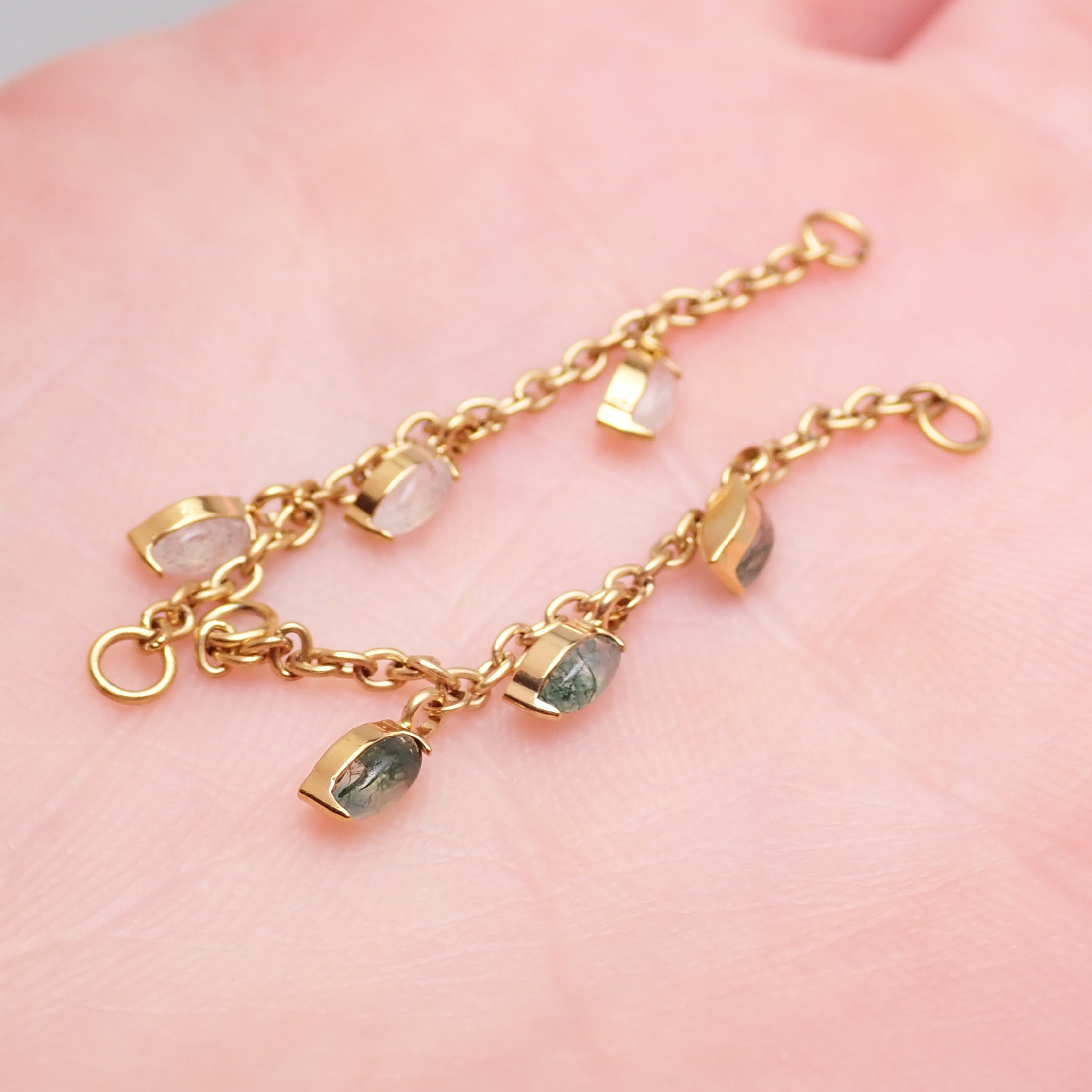 Body Clickers implant titanium body jewelry with moss agate and moonstone charms, featuring a natural stone piercing chain.