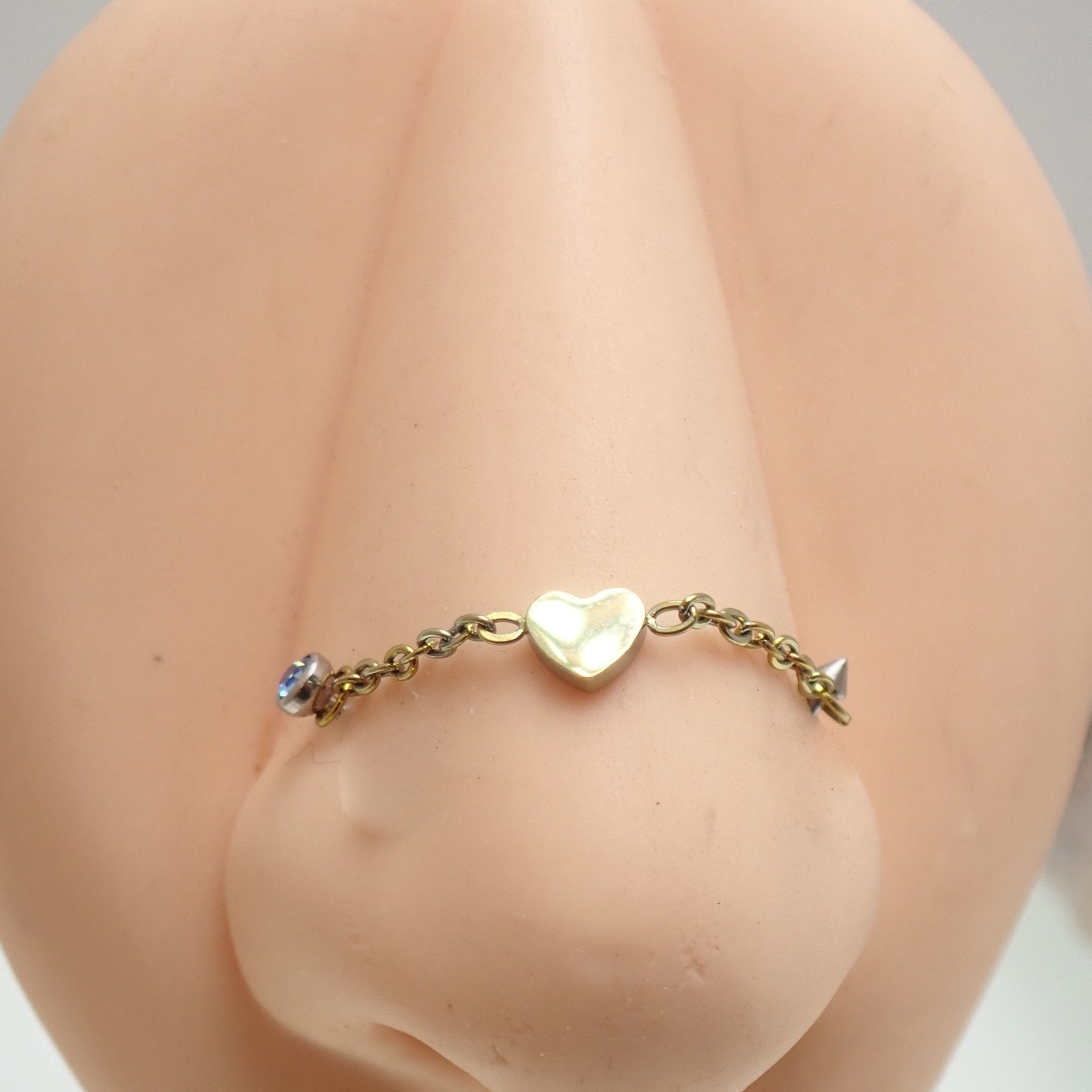 Titanium chain body jewelry by Body Clickers with a heart-shaped pendant, suitable for various piercings, 30mm length.