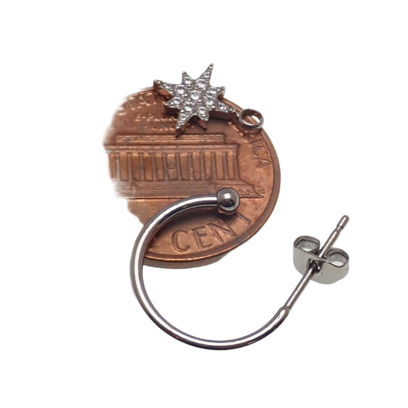 Titanium hoop earrings with charms by Body Clickers Body Jewelry, 20g, showcasing sleek silver hoops with decorative charms.