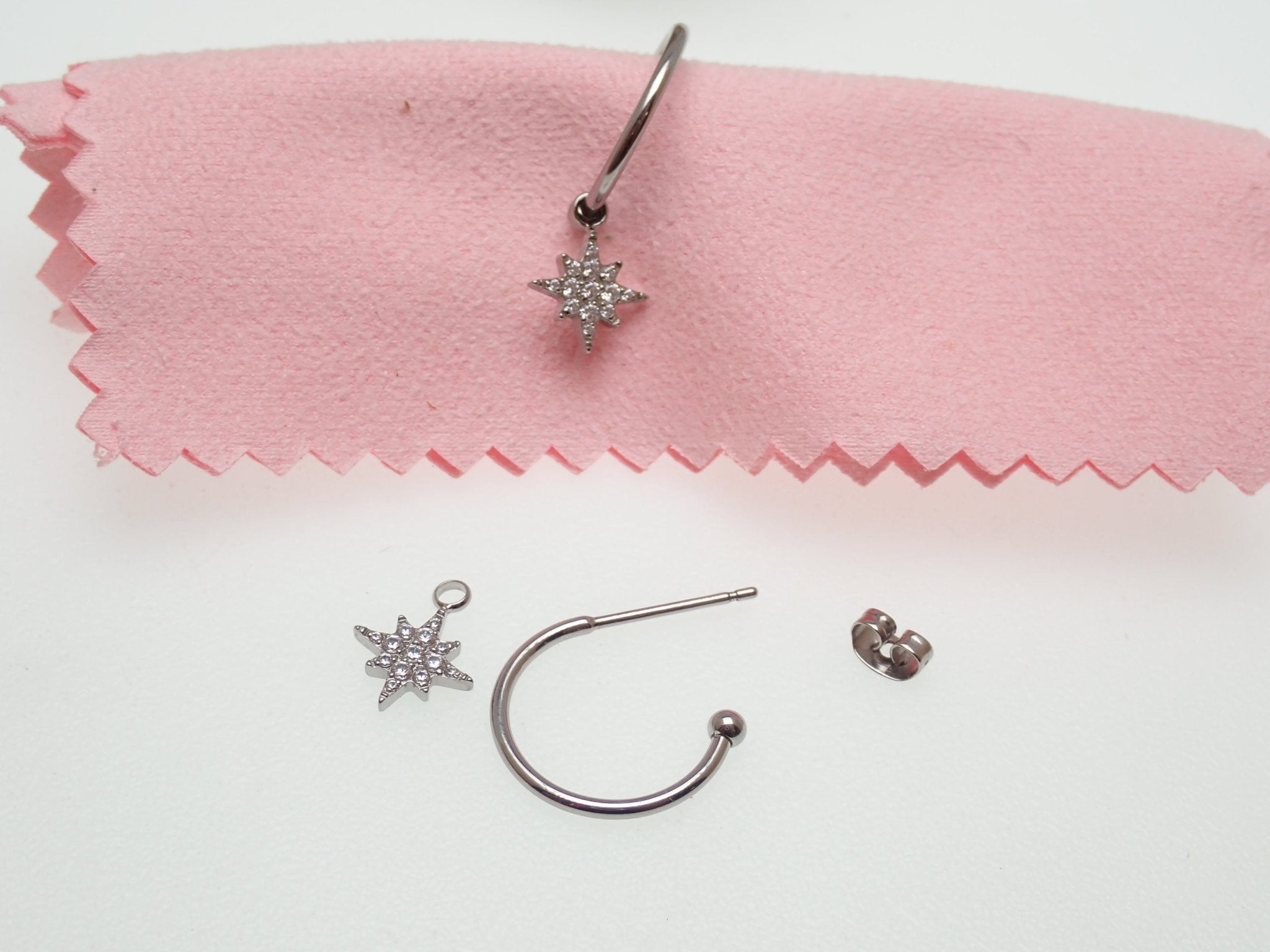 Titanium hoop earrings with charms by Body Clickers Body Jewelry, 20g titanium earrings for piercing or jewelry adornment.