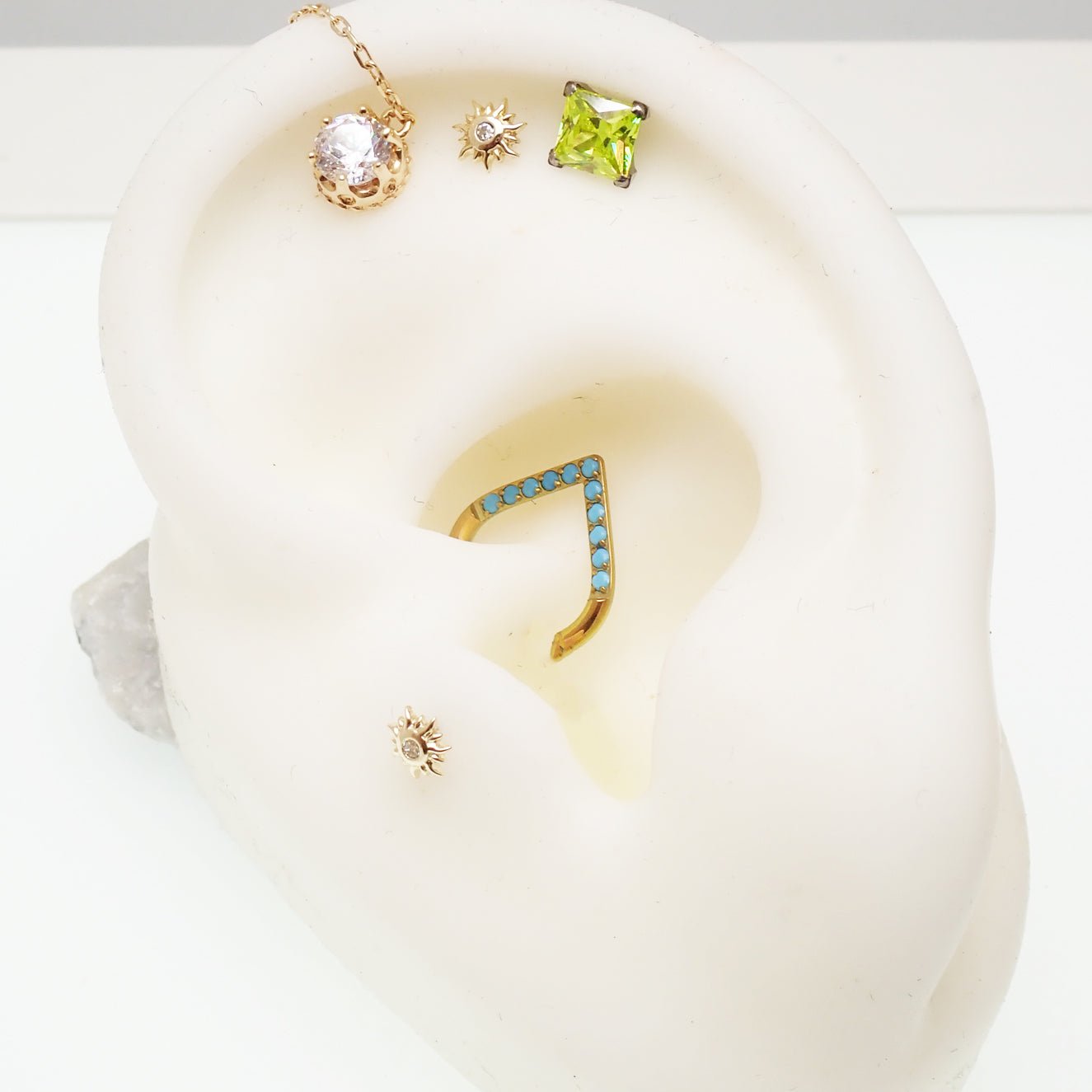 16g turquoise titanium clicker with 8mm diameter, daith piercing jewelry from Body Clickers Body Jewelry.