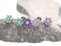 Pink flower fire opals flatback piercing by Body Clickers, 18g gauge with 6mm flower-shaped gemstone design.