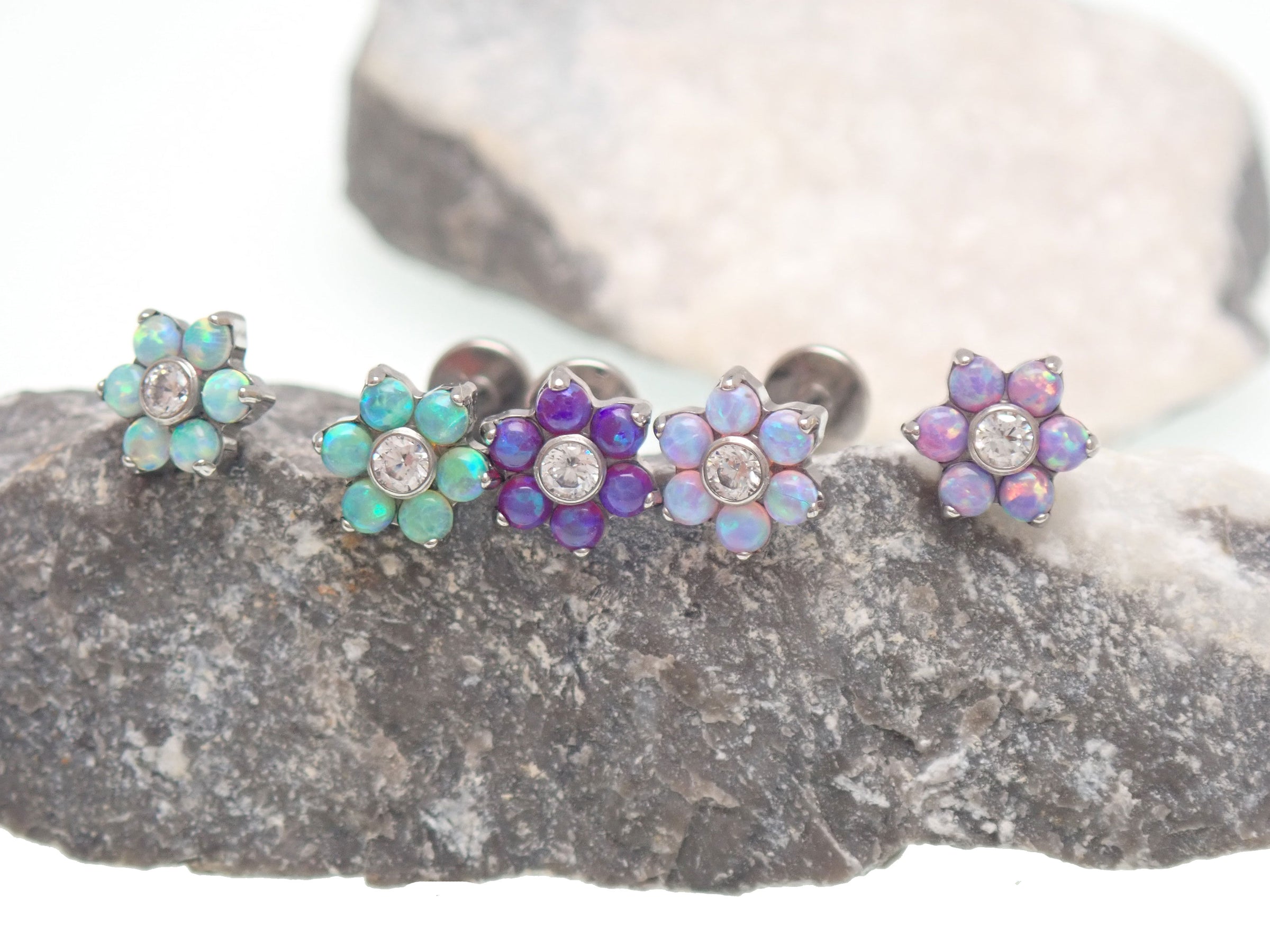 Pink flower fire opals flatback piercing by Body Clickers, 18g gauge with 6mm flower-shaped gemstone design.