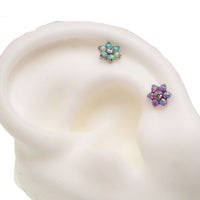 Body Clickers flower fire opals flatback piercing in 18g with 6mm flower-shaped fire opal gemstone.
